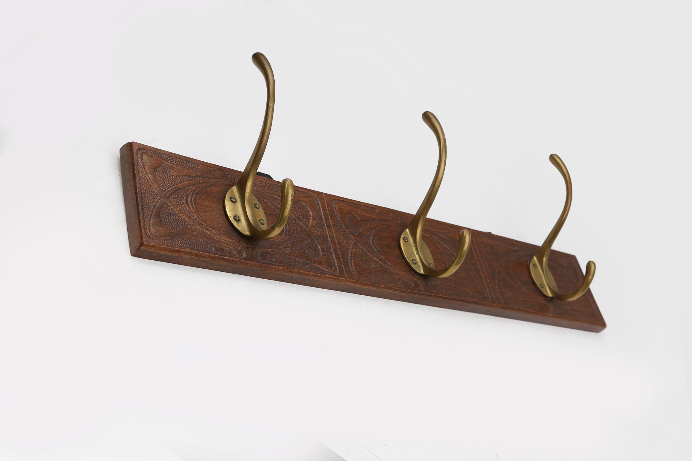 Art Nouveau wall coat rack in carved wood with brass, France ca. 1910thumbnail